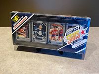 Front of sealed card box showing sample cards and branding