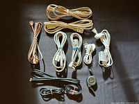 All ten assorted cables arranged on surface