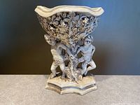 Front view of Capodimonte cherub centerpiece planter showing figures and bowl relief