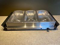 Full view of buffet server with three lidded trays