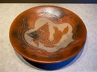 Top view showing entire bowl with fish and wave design