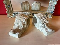 Mirror front with finials reflected