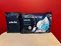 Front view of both sealed Derila packages, pillow and cover