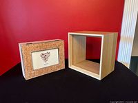 Shelf and box front view against red backdrop