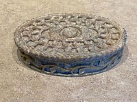 Closed trinket box showing carved lid and side detail