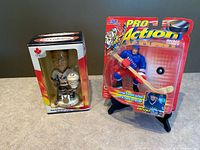 Both packaged collectibles side by side
