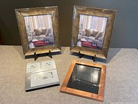 overview showing two square gold frames, silver collage frame and copper frame