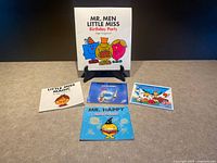 All five books front covers displayed