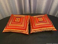 Front view showing concentric square design on both pillows