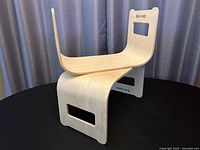 Two bentwood desks stacked showing curved profile and handle cutouts