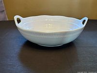Top view of white Roscher porcelain serving bowl showing ribbed detail and handles
