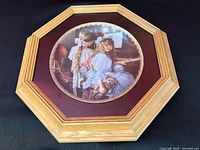 Front view of framed porcelain plate