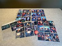 Wide view of all 40 Star Trek: TNG cards laid out in binder pages
