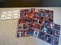 Assorted Star Trek trading cards laid out with one sheet showing card backs
