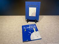 Slipcased edition on stand and hardcover shown separately