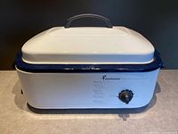 Full view of white Toastmaster 18-quart roaster oven with lid
