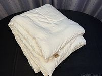 Comforter folded to show overall bulk and color