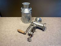 Overall lot showing grinder and milk can