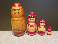 Full view of all four nesting dolls standing in size order