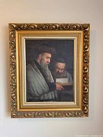 Full view showing framed oil painting of two rabbis