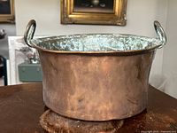 Front view of copper pot showing exterior patina