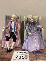 Front view of both Royal Doulton figurines Darby and Joan in chairs