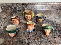 Group view showing all six miniature Toby jugs