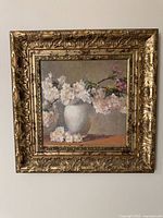 Frontal view of framed painting showing full artwork and ornate frame