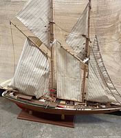 Full view of schooner model on stand showing sails and hull