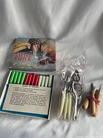 Boxed set of coloured-handle forks, sealed pack of forks, two wooden-handled forks