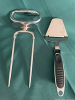 Carving fork and cheese slicer side by side