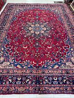 Full view of entire Mashhad rug showing pattern and borders