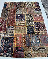 Full view of entire patchwork Persian rug showing overall pattern and dimensions