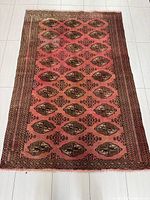 Full view of rectangular Turkman rug showing overall pattern and size