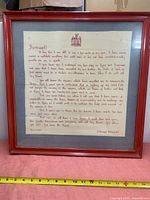 Full view of framed abdication speech with ruler for scale