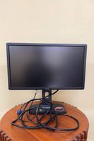 Front view of Dell U2312HM monitor with cables displayed
