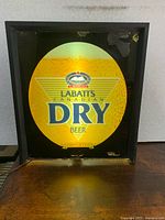 Front view showing illuminated Labatt’s Canadian Dry Beer graphic