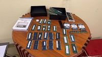 Overall lot view showing RAM sticks, boxed modules, microSD tray