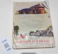 Full view of catalogue showing back cover illustration, wear, auction tag