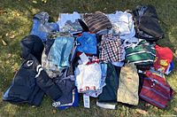 All clothing items laid out on grass for overview