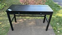 Front view of black-brown IKEA Hemnes desk