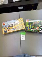 Both Lego sets on tabletop showing front packaging
