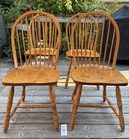 Front view of four Bermex Windsor chairs on deck