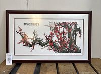 front view showing complete framed embroidery and calligraphy