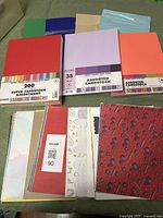 Overall view of three cardstock packs and loose printed sheets