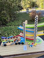 Car carrier truck, six race cars, switchback racetrack tower, four small cars