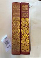 Spines showing titles, volume numbers and publisher