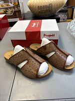 Top view of the pair showing leather uppers and packaging