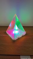 Color-changing acrylic pyramid lamp illuminated