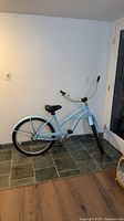 full side view of the light blue Marin beach cruiser